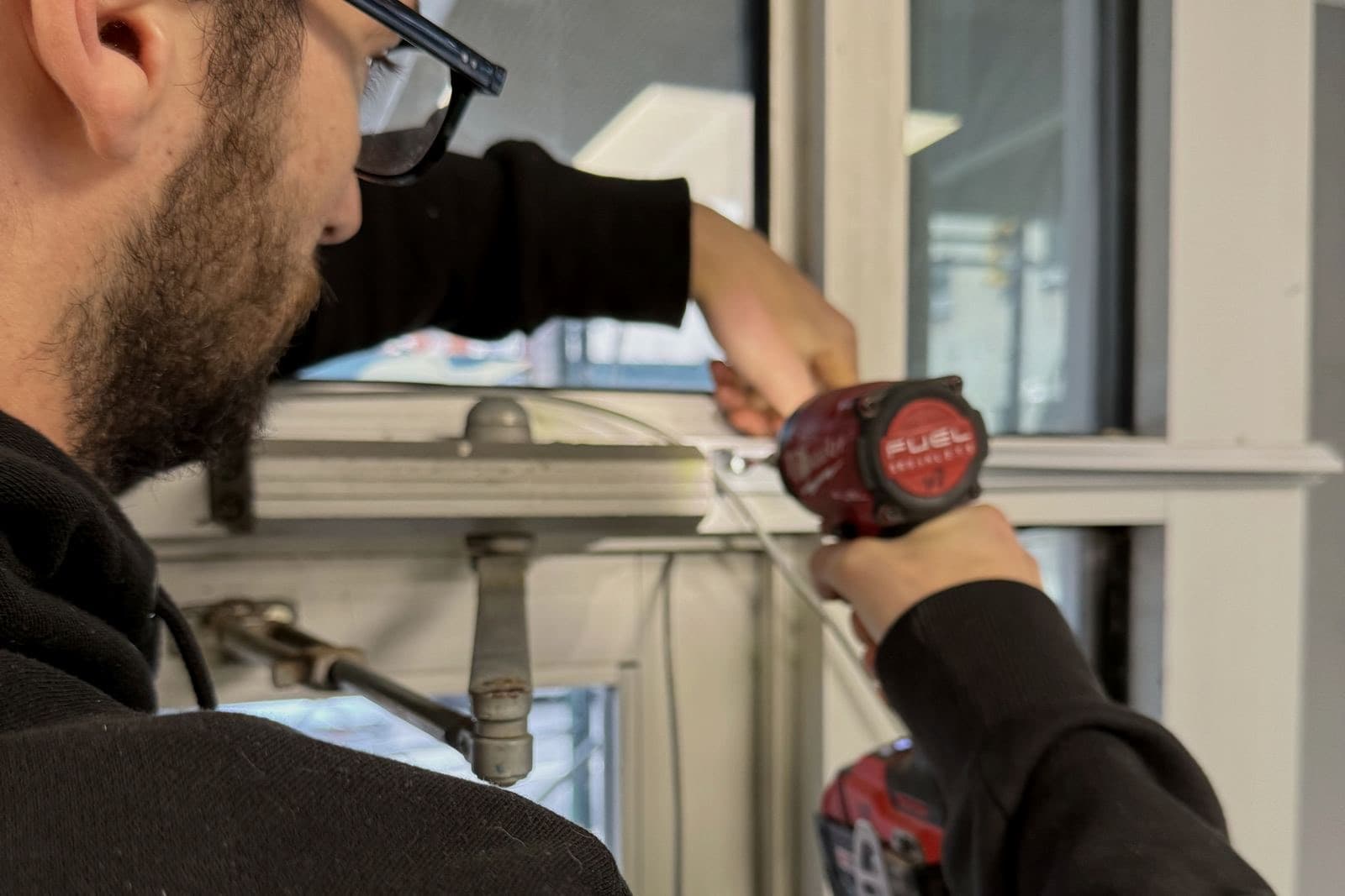 Window lock being serviced on site