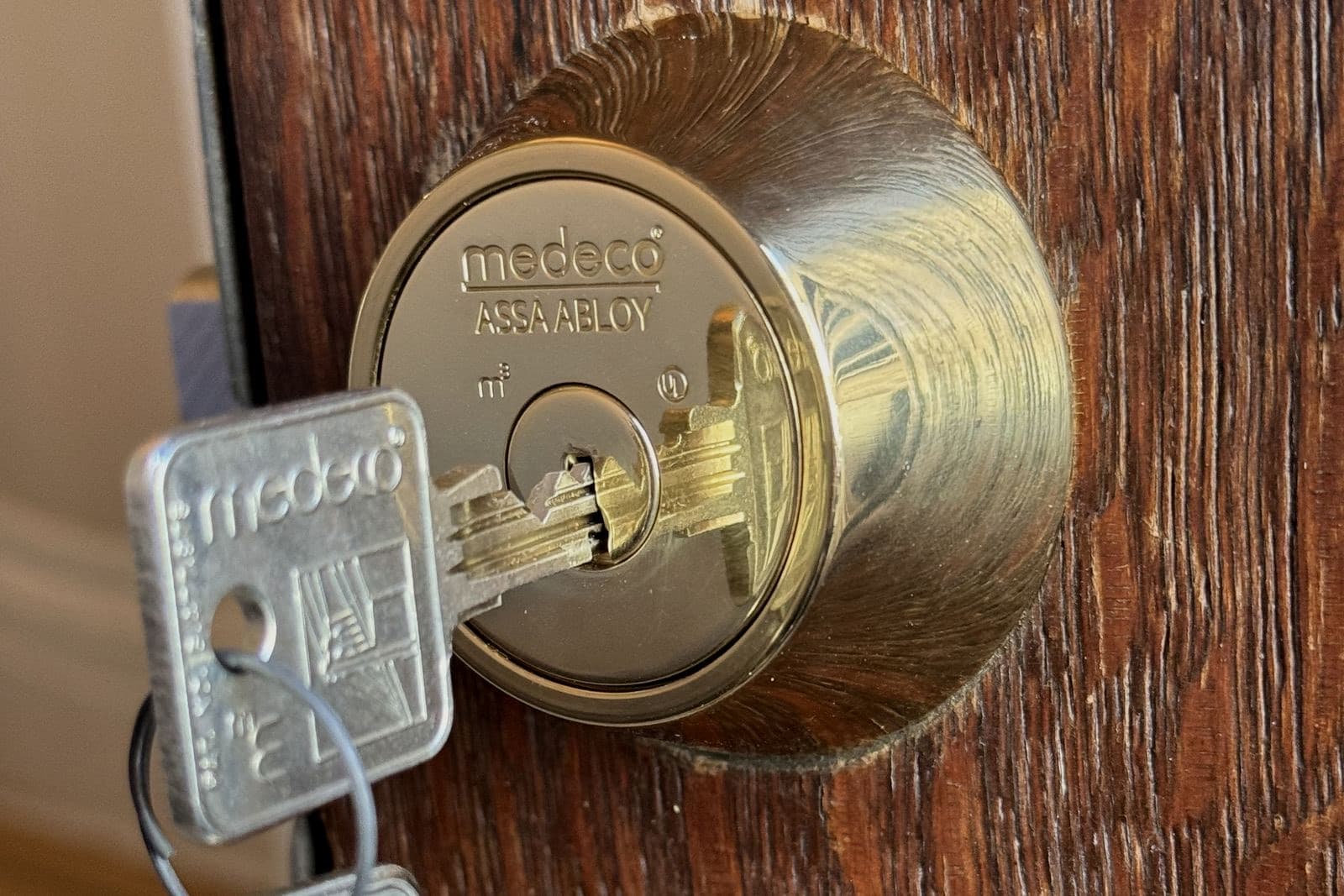 Brass deadbolt being fitted with a drill driver